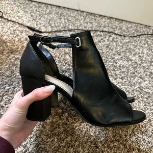 Black heeled open toed booties by XIT